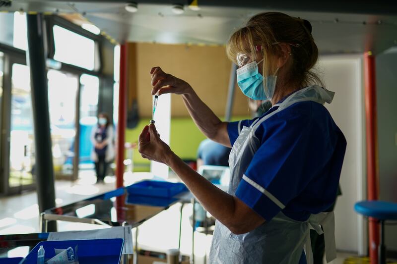 A nurse draws up a Covid-19 vaccine in Newcastle upon Tyne, northern England. Many restrictions are due to be lifted on July 19. Getty Images
