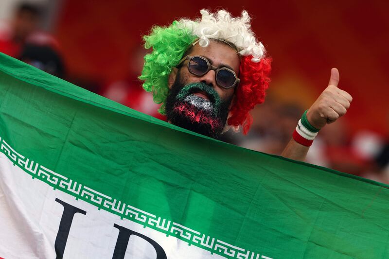 This Iran supporter sports his country's colours in the build-up to the World Cup match against England at the Khalifa International Stadium in Doha on Monday. AFP