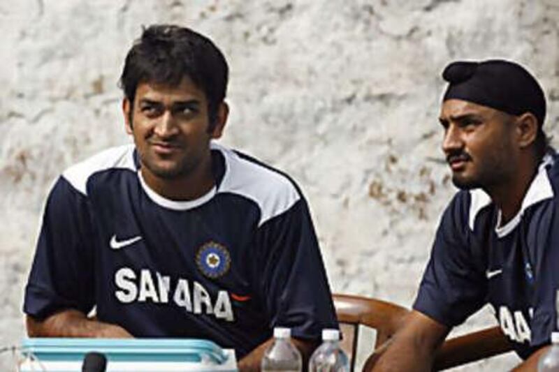 Mahendra Dhoni, left, has taken over as captain of India since Anil Kumble's retirement after the Dehli Test.