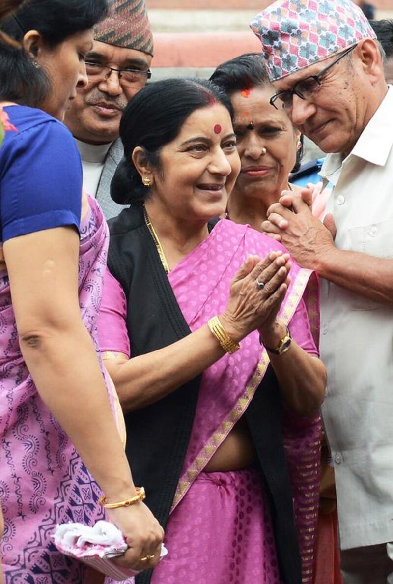 Sushma Swaraj, the Indian foreign minister, visits the Pashupatinath Temple in Kathmandu yesterday while on a three-day official visit to Nepal, during which 26 cooperation agreements were reached. Prakash Mathema / AFP