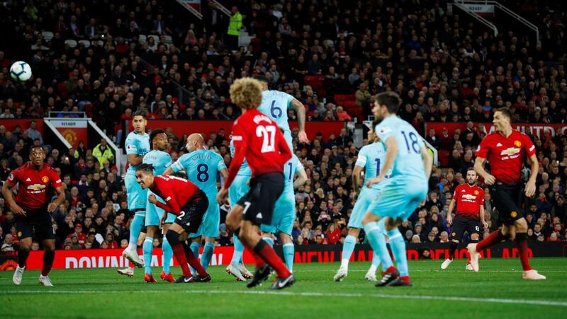 Manchester United's Juan Mata scores their first goal from a freekick. Reuters