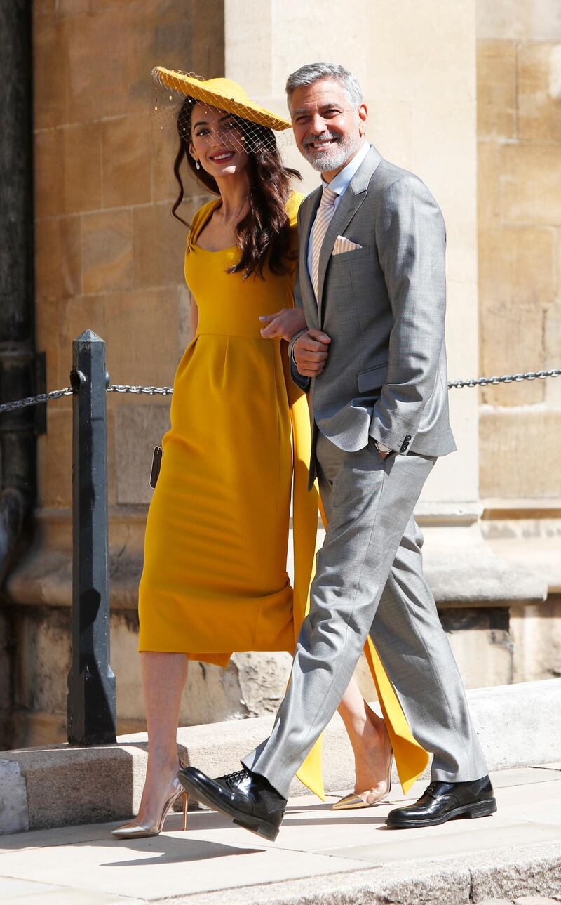 WINDSOR, UNITED KINGDOM - MAY 19:  Amal Clooney and George Clooney arrive at St George's Chapel at Windsor Castle for the wedding of Prince Harry and Meghan Markle on May 19, 2018 in Windsor, England. (Photo by Alastair Grant - WPA Pool/Getty Images)