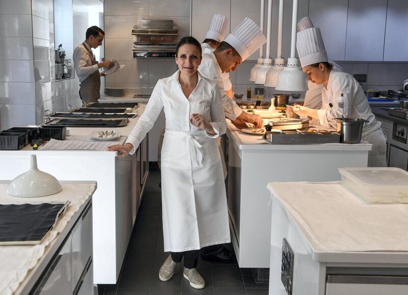 To mark the occasion of International Women's Day on March 8, 2018 AFP presents a series of 45 photos depicting women performing roles or working in professions more traditionally held by men.  More images can be found in www.afpforum.com  Search SLUG  "WOMEN-DAY -PACKAGE". 
French chef Anne-Sophie Pic, the only female three-starred Michelin chef in France and one of a handful in the world, poses on March 2, 2018 in the kitchen of her restaurant "La maison Pic" in Valence, southeastern France.   
In the ring, battling flames or lifting off into space, women have entered professions generally considered as men's jobs. For International Women's Day, AFP met with women breaking down the barriers of gender-bias in the work world. / AFP PHOTO / PHILIPPE DESMAZES