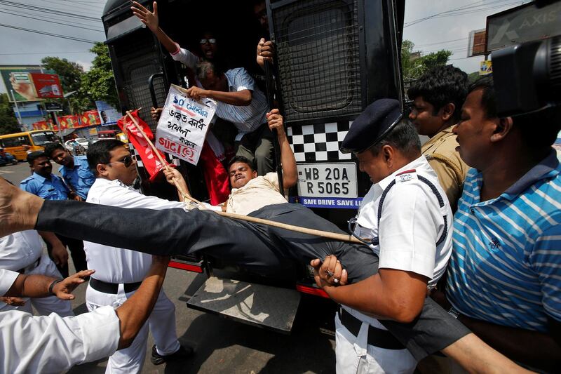 Police detain an activist of Socialist Unity Centre of India (SUCI) during a nationwide strike against hike in fuel prices, in Kolkata, India September 10, 2018. REUTERS/Rupak De Chowdhuri