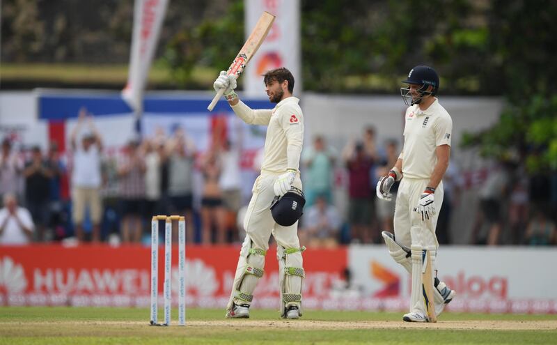 Ben Foakes celebrates reaching his century as James Anderson looks on during day two of the First Test. Getty Images