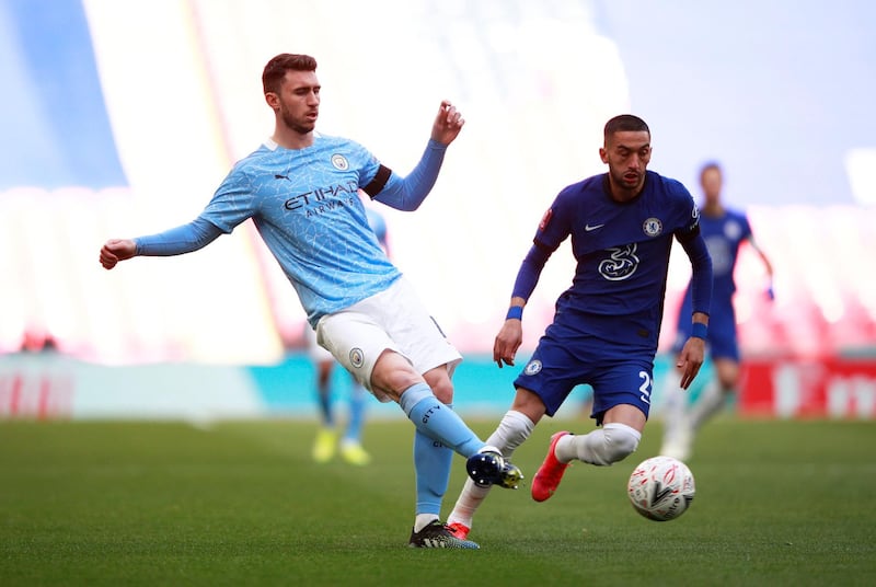 FILE PHOTO: Soccer Football -  FA Cup Semi Final - Chelsea v Manchester City  - Wembley Stadium, London, Britain - April 17, 2021 Manchester City's Aymeric Laporte in action with Chelsea's Hakim Ziyech Pool via REUTERS/Ian Walton/File Photo