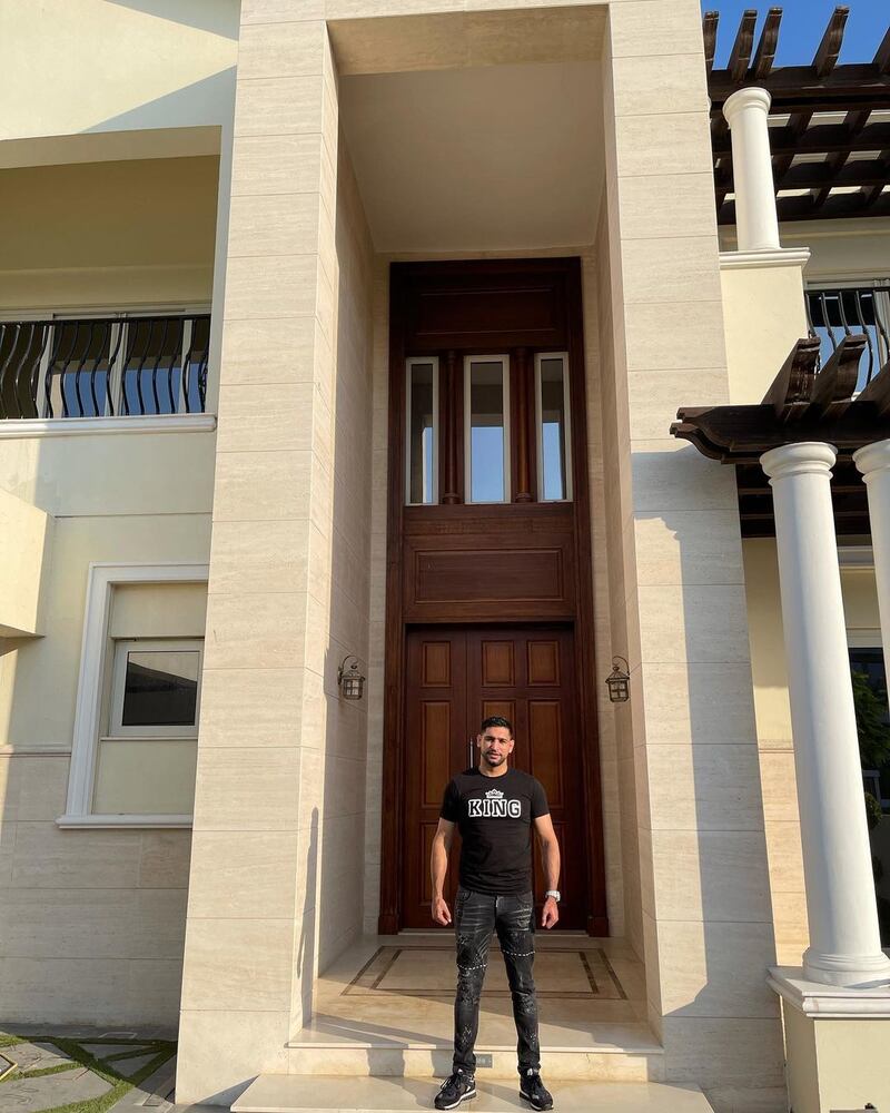 Amir Khan poses outside his new Dubai holiday home in District One, Mohammed Bin Rashid City in December 2020. Instagram / Amir Khan