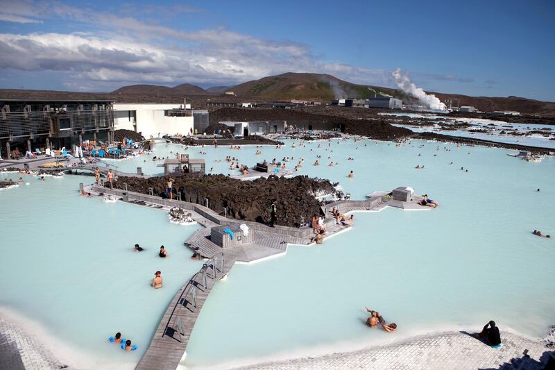 Looking down at locals and tourists in the thermal pools at the Blue Lagoon Spa just outside of Reykjavik, Iceland. Iceland is one of the most isolated countries at the world and has been drawing adventure tourists for years and continues to be one of the most visually stunning places in the world. (Photo by Ryan Pyle/Corbis via Getty Images)