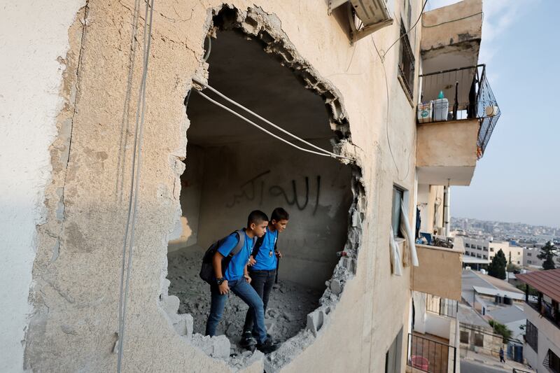 Palestinians inspect the remains of the house of Raed Hazem, who killed three Israelis in an attack in Tel Aviv in April, after it was demolished by Israeli forces in Jenin in the Israeli-occupied West Bank. Reuters