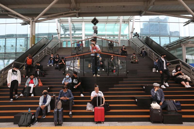 Passengers wait for their trains at the Seoul Railway Station in South Korea. South Korea reported fresh cases of the new coronavirus are continuing a month-long downturn. AP Photo