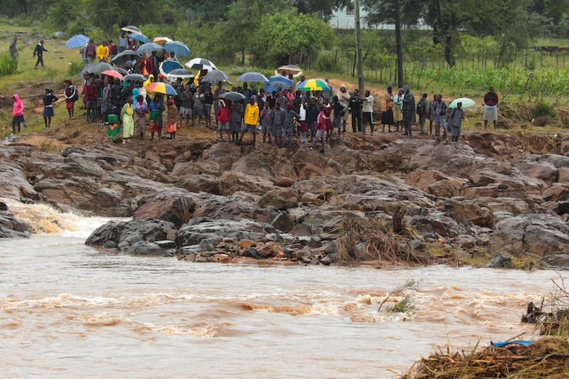 Schoolchildren are stranded across a collapsed bridge in Chimanimani, southeast of Harare, Zimbabwe. AP Photo