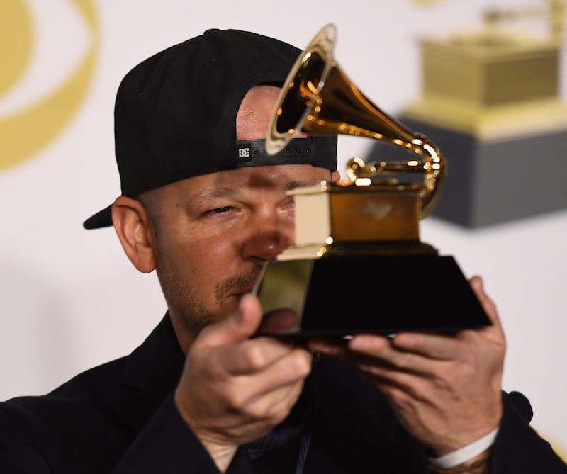 Recording artist Residente, winner of the Best Latin Rock, Urban or Alternative Album award for 'Residente,' poses in the press room. AFP