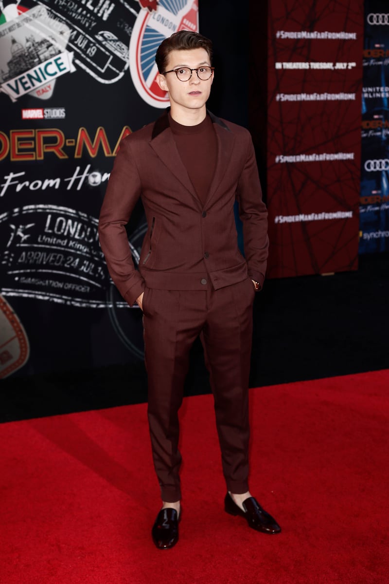 Tom Holland, in an oxblood Zenga suit and T-shirt, attends the 'Spider-Man: Far From Home' premiere at the TLC Chinese Theatre in Hollywood, California on June  26, 2019. EPA