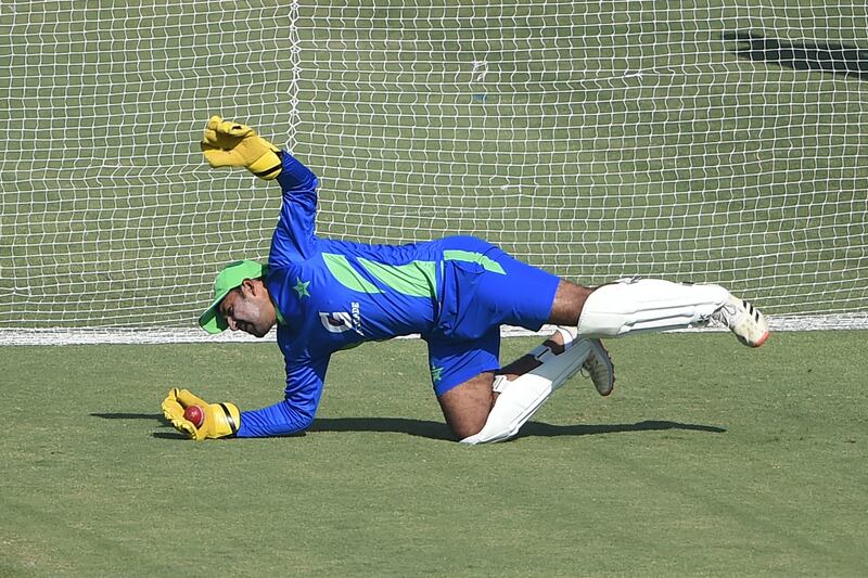 Pakistan's Sarfaraz Ahmed takes a catch during training. AFP
