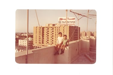 A 1984 picture of the Babu boys in front of Al Mareija Building, built by the Egyptian architect Ali Bek Nasser in the 1970s. The picture is taken from the roof of Sultan Sooud Al Qassemi's office building. 