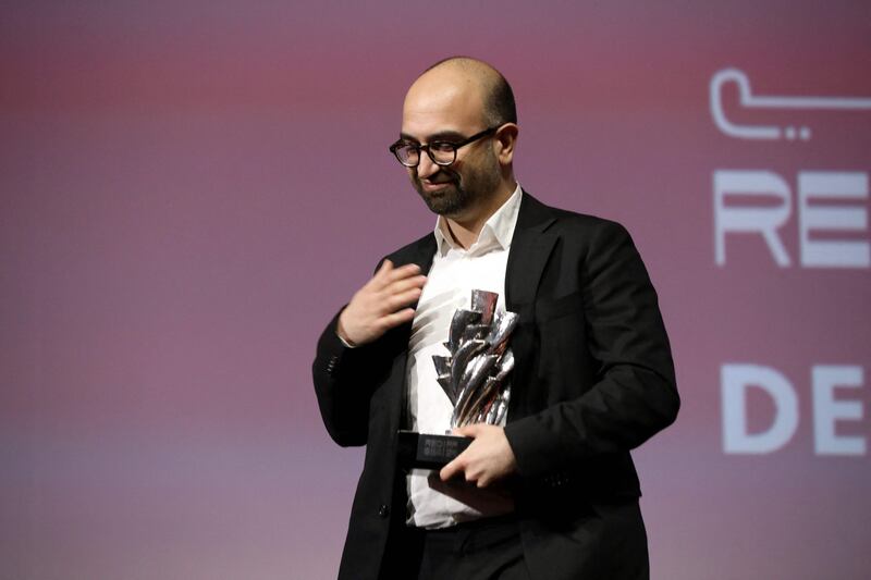 Italian-Iraqi film director Haider Rashid receives his Best Director award for his film 'Europa'.   Photo: Red Sea International Film Festival / AFP