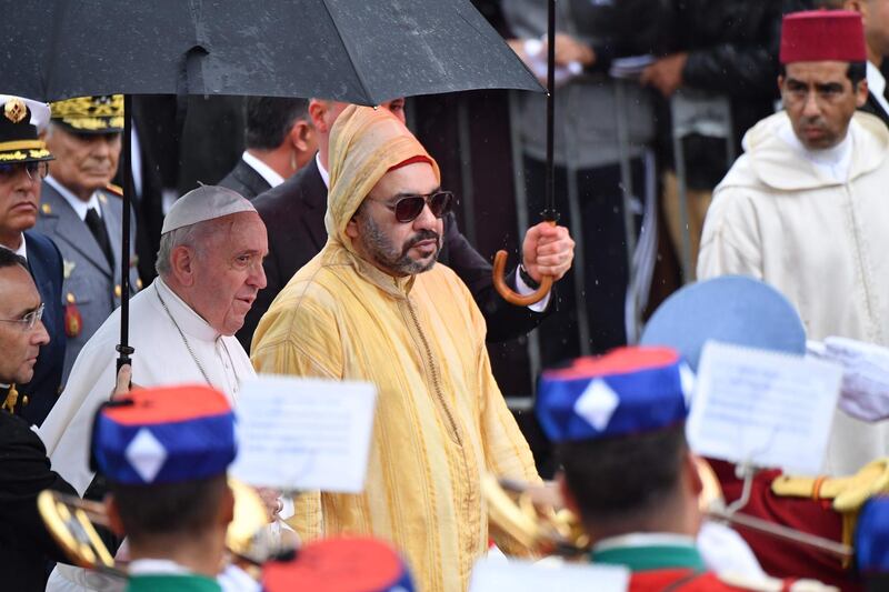 King Mohammed VI welcomes Pope Francis in Rabat. AFP
