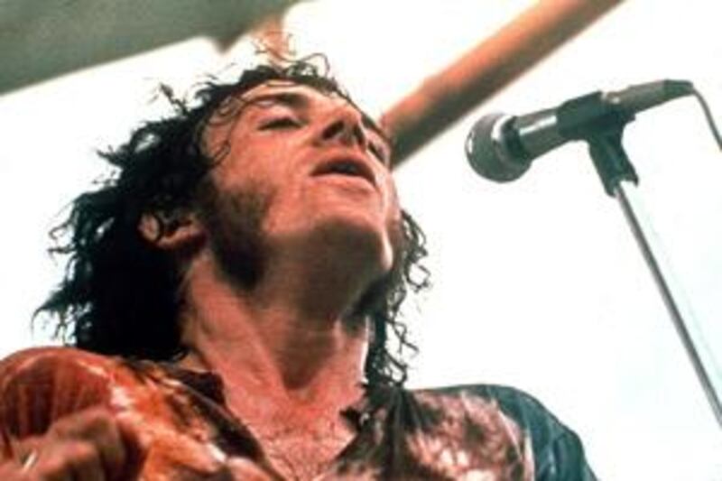 Joe Cocker performing at the Woodstock Music and Arts Festival.