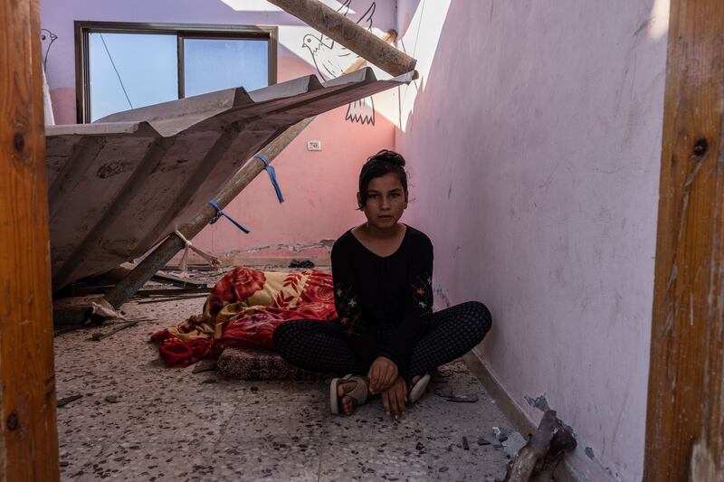 Taghrid Nassir's daughter Dunya, 13, sits in what used to be her bedroom.
