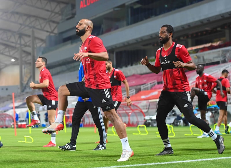 UAE defender Mohammad Marzouq (l) trains at the Abdullah bin Khalifa Stadium in Doha ahead of the national team's 2022 World Cup play-off against Australia on Tuesday. Photo: UAE FA