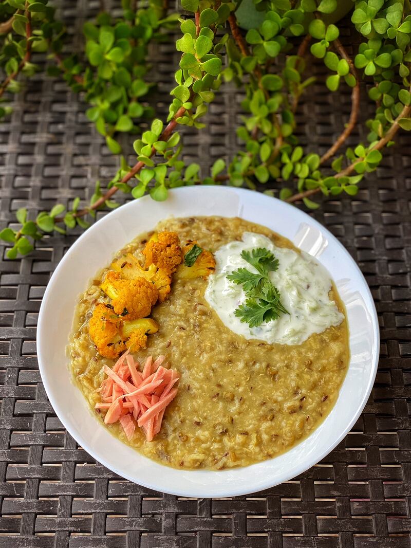 Khichdi has long been eaten to ease digestive issues or when one is feeling under the weather. Seen here is a version with moong daal, served with a side of yogurt mixed with grated cucumber, potatoes, cauliflower and pickled ginger.
