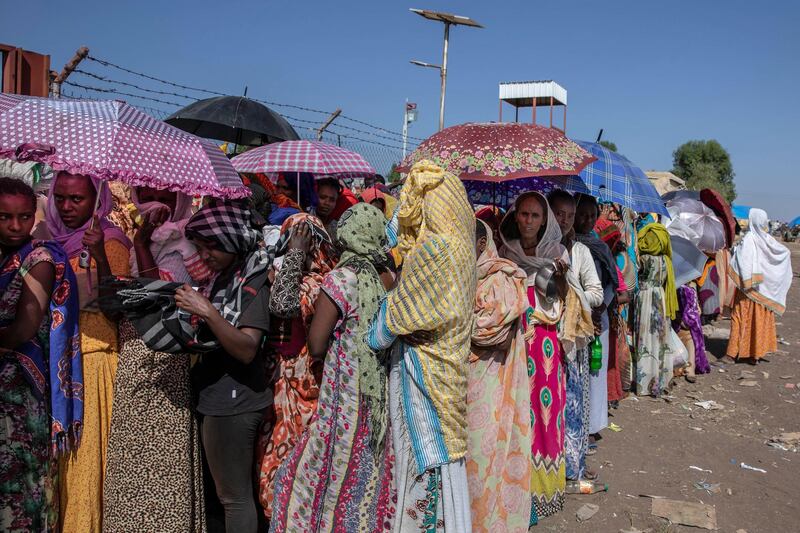 Tigray women who fled the conflict in the Ethiopia's Tigray region, wait for UNHCR to distribute blankets at Hamdayet Transition Center, eastern Sudan. AP Photo