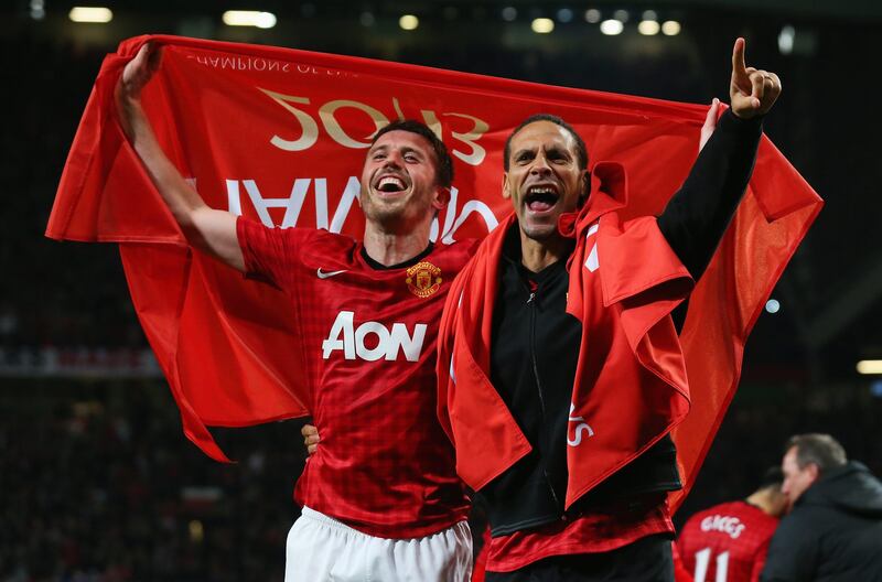 MANCHESTER, ENGLAND - APRIL 22:  Michael Carrick (L) and Rio Ferdinand of Manchester United celebrate winning the Premier League title after the Barclays Premier League match between Manchester United and Aston Villa at Old Trafford on April 22, 2013 in Manchester, England.  (Photo by Alex Livesey/Getty Images) *** Local Caption ***  167221453.jpg