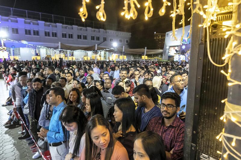 DUBAI, UNITED ARAB EMIRATES. 25 DECEMBER 2019. Midnight Mass at St Mary’s in Dubai to celebrate Christmas. People stand patiently during the ceremony. (Photo: Antonie Robertson/The National) Journalist: None. Section: National.
