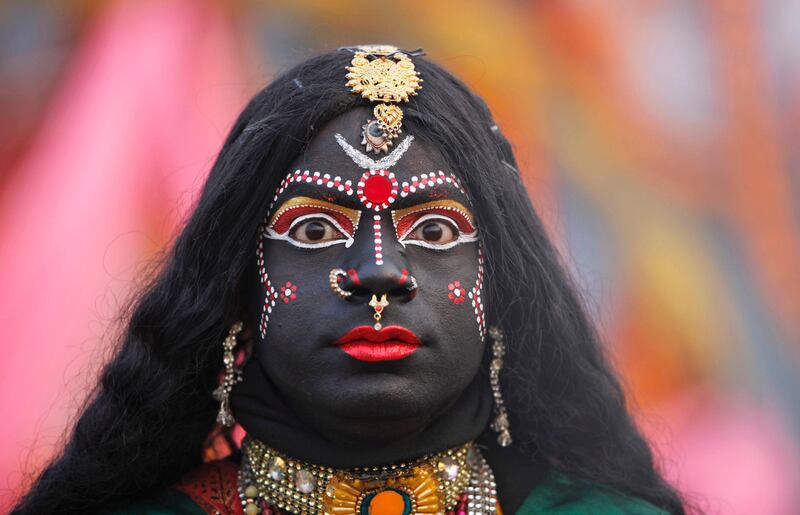 A man, dressed as Hindu Goddess Kali, participates in a religious procession towards the Sangam, the confluence of rivers Ganges, Yamuna and mythical Saraswati, as part of the Mahakumbh festival in Allahabad, India, Sunday, Jan. 6, 2013. Millions of Hindu pilgrims are expected to take part in the large religious congregation on the banks of Sangam during the Mahakumbh festival in January 2013, which falls every 12th year. (AP Photo/Rajesh Kumar Singh) *** Local Caption ***  India Kumbh Festival.JPEG-07d2d.jpg