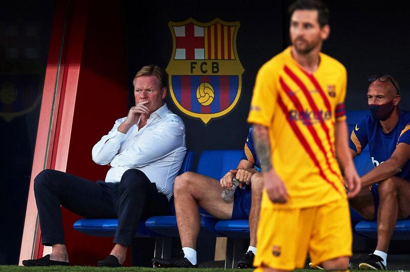 Barcelona manager Ronald Koeman watches on as Lionel Messi takes part in the pre-season friendly match at Johan Cruyff Stadium. EPA