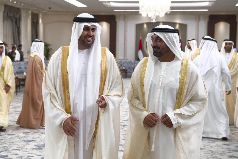 ABU DHABI, UNITED ARAB EMIRATES - June 15, 2018: HH Sheikh Theyab bin Mohamed bin Zayed Al Nahyan, Chairman of the Department of Transport, and Abu Dhabi Executive Council Member (L) and HH Sheikh Ahmed bin Saeed Al Maktoum, President of the Department of Civil Aviation, CEO and Chairman of The Emirates Group, and Chairman of Dubai World (R), attend an Eid Al Fitr reception at Mushrif Palace. 

( Saeed Al Neyadi / Crown Prince Court - Abu Dhabi )
---