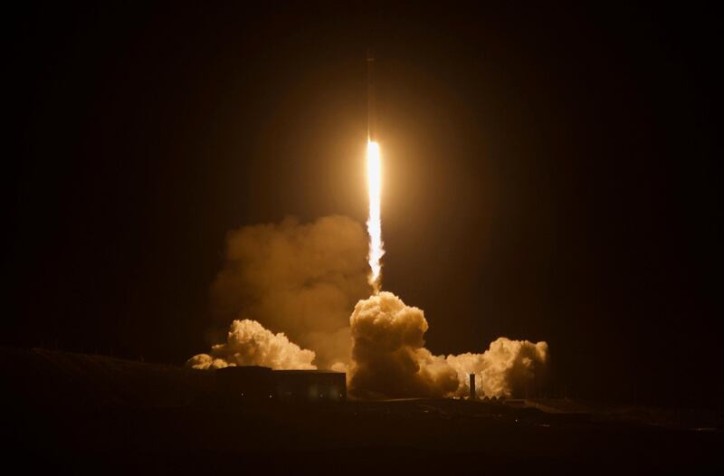 In this Friday, Dec. 22, 2017, photo a Falcon 9 rocket lifts off from Vandenberg Air Force Base in Calif. A reused SpaceX rocket carried 10 satellites into orbit from California on Friday, leaving behind a trail of mystery and wonder as it soared into space. The Falcon 9 booster lifted off from coastal Vandenberg Air Force Base, carrying the latest batch of satellites for Iridium Communications. (Matt Hartman via AP)