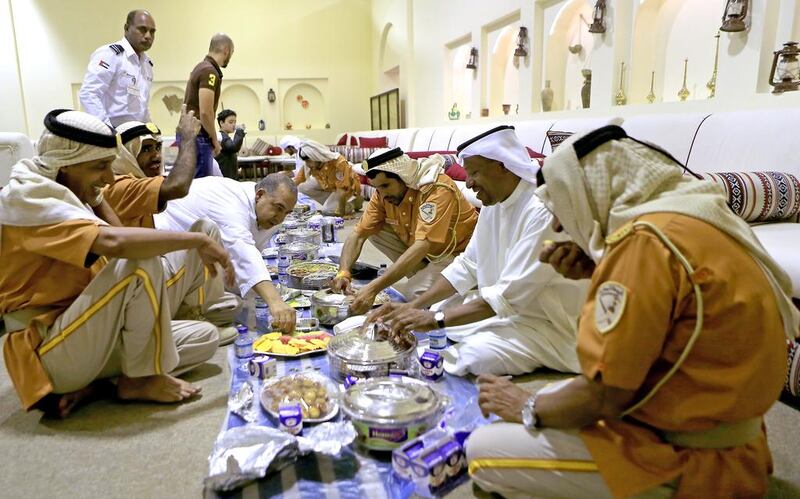 All smiles as old fort guards and other officials break their fast at Qasr Al Hosn in Abu Dhabi on July 1, 2014. Ravindranath K / The National