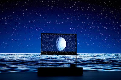 The LG Signature OLED T transparent TV, seen at CES 2024, can double as furniture as it can blend in with its environment. AP
