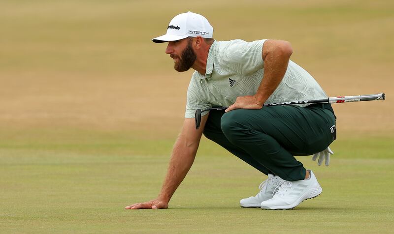Dustin Johnson of the United States lines up a putt on the 9th green. Getty