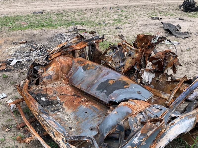 Some of the abandoned cars on Ukraine’s roads have been damaged by mines.