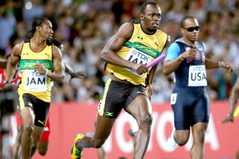 After taking the baton from Yohan Blake, left, Usain Bolt, centre, simply ran away from Walter Dix, right, and all other challengers.