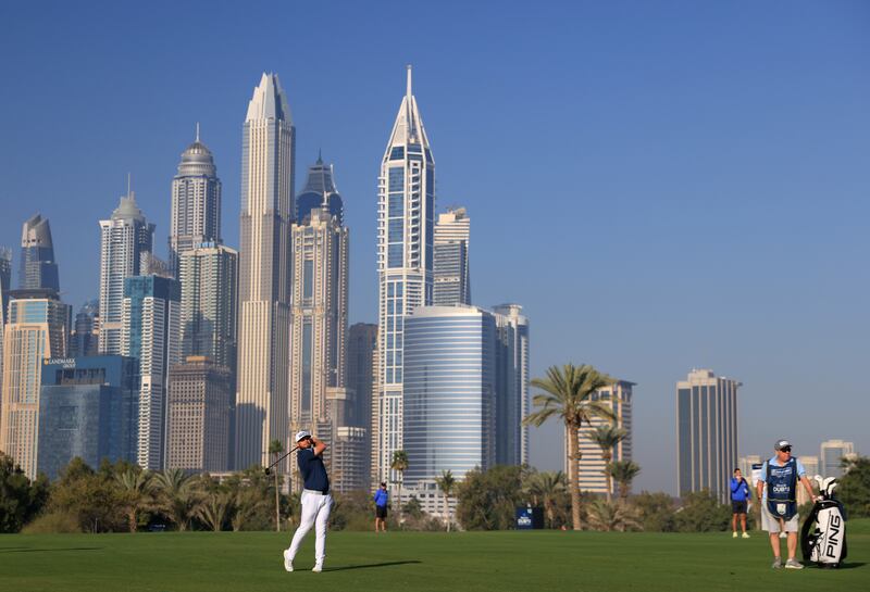 Tyrrell Hatton plays his approach shot on the 13th hole. Getty 