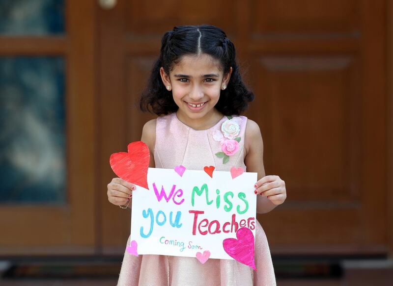 Dubai, United Arab Emirates - Reporter: N/A. Photo Project. Missing our teachers. Shamma Tahlak, aged 8 from the UAE and her teachers are Miss Hannah, Miss Kholoud, Miss Doa and Miss Rahaf at GEMS national school for girls. "We miss you teachers, coming soon". Monday, June 8th, 2020. Dubai. Chris Whiteoak / The National