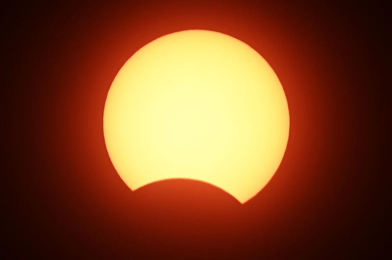 The moon covers the sun in Islamabad, India. AFP