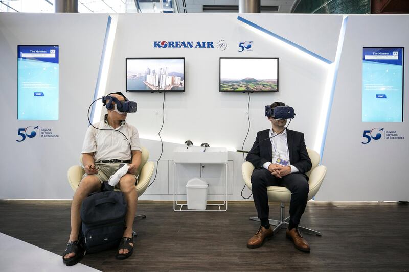 Attendees wear virtual reality (VR) headsets at the Korean Air Lines booth at the IATA annual general meeting in Seoul, South Korea. Bloomberg