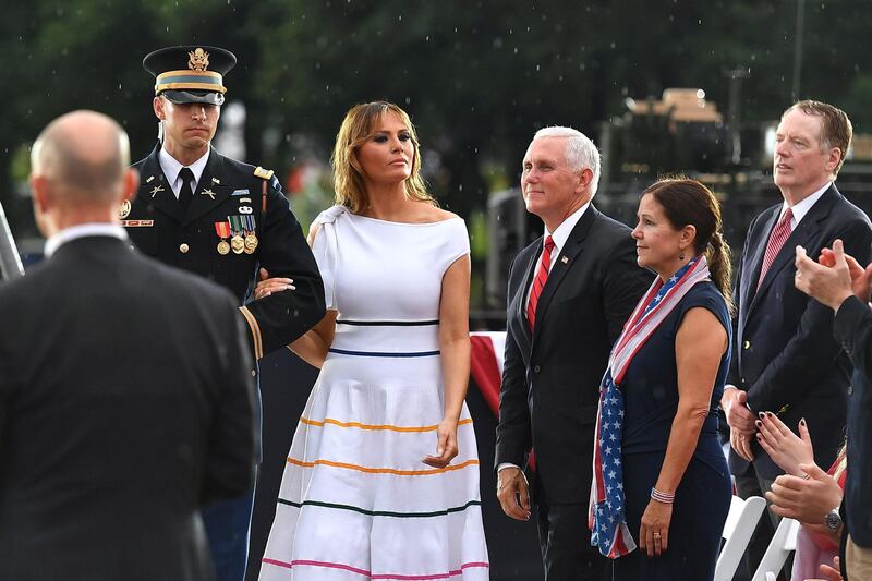 US First Lady Melania Trump (C) is escorted to the stage during the "Salute to America" Fourth of July event at the Lincoln Memorial in Washington. AFP/ MANDEL NGAN