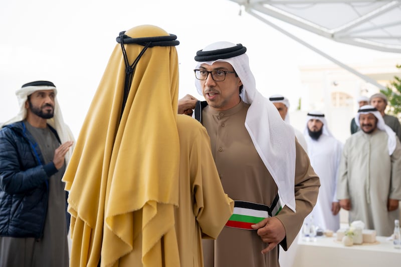 Sheikh Mohamed bin Rashid, Vice President and Ruler of Dubai, awards Sheikh Mansour bin Zayed, Deputy Prime Minister and Minister of the Presidential Court, with the Mohammed bin Rashid Sash