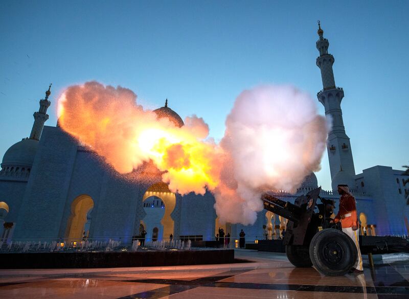 A cannon is fired at the Sheikh Zayed Grand Mosque in Abu Dhabi to mark the end of fasting and start of iftar on the first day of Ramadan. Victor Besa / The National