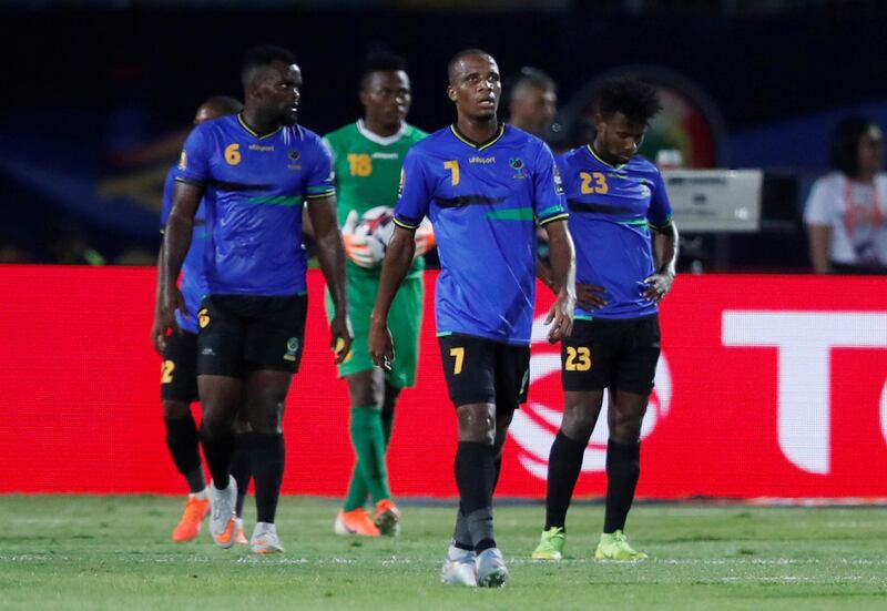 Tanzania's Himid Mao, David Mwantika, Mudathiri Yahya and tea mates look dejected after Senegal's Krepin Diatta scores their second goa. Reuters