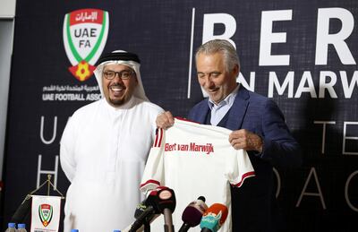 ABU DHABI , UNITED ARAB EMIRATES , March 21 – 2019 :- Left to Right - Abdulla Naser Al Junaibi , UAEFA Vice Chairman giving football t-shirt with the printed name of Bert Van Marwijk , UAE National Team Head Coach during the press conference held at Al Nahyan Stadium in Abu Dhabi. ( Pawan Singh / The National ) For Sports. Story by John