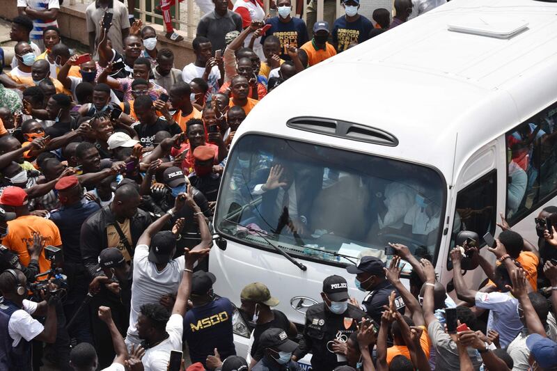 Supporters cheer as they surround a bus carrying former Chelsea star Didier Drogba after he submitted his application to become president of the Ivorian football federation at the FIF headquarter in the Treicheville district of Abidjan. AFP