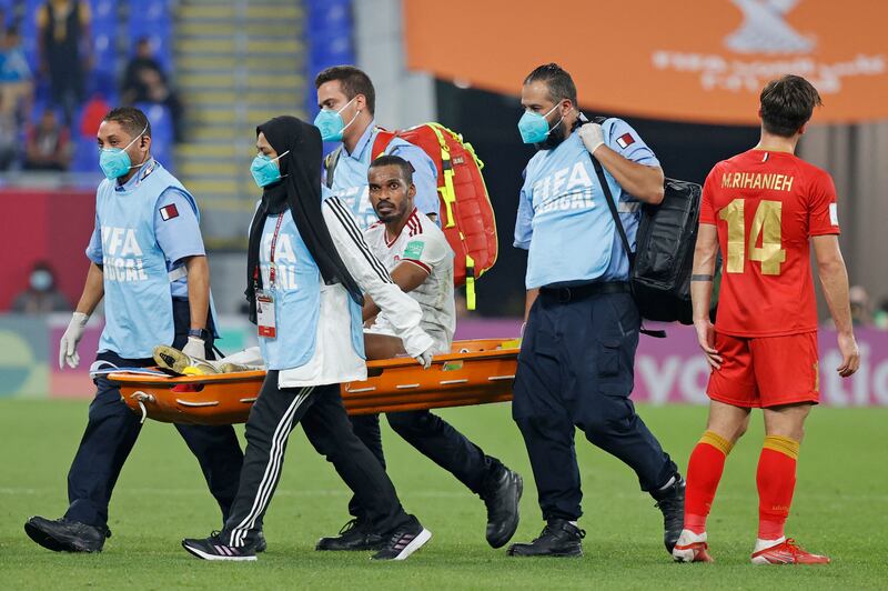 UAE defender Mahmoud Khamis is carried off the pitch after an injury . AFP