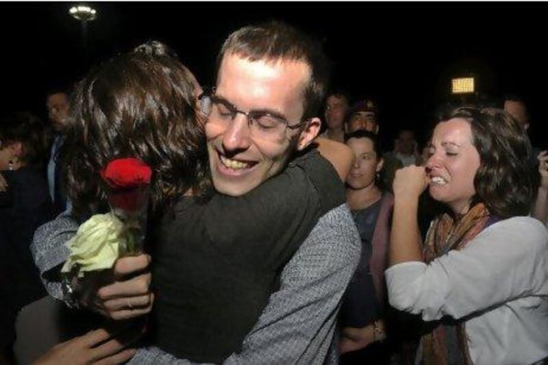 Freed American Shane Bauer, centre, is welcomed upon his arrival from Iran, in Muscat, Oman. Sultan Al Hasani / AP Photo