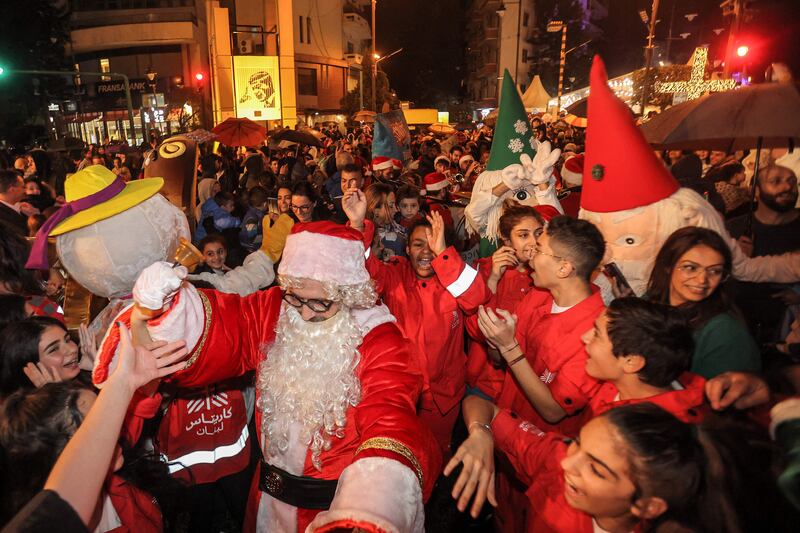 Festive revellers greet Santa in Sassine Square, Beirut. AFP